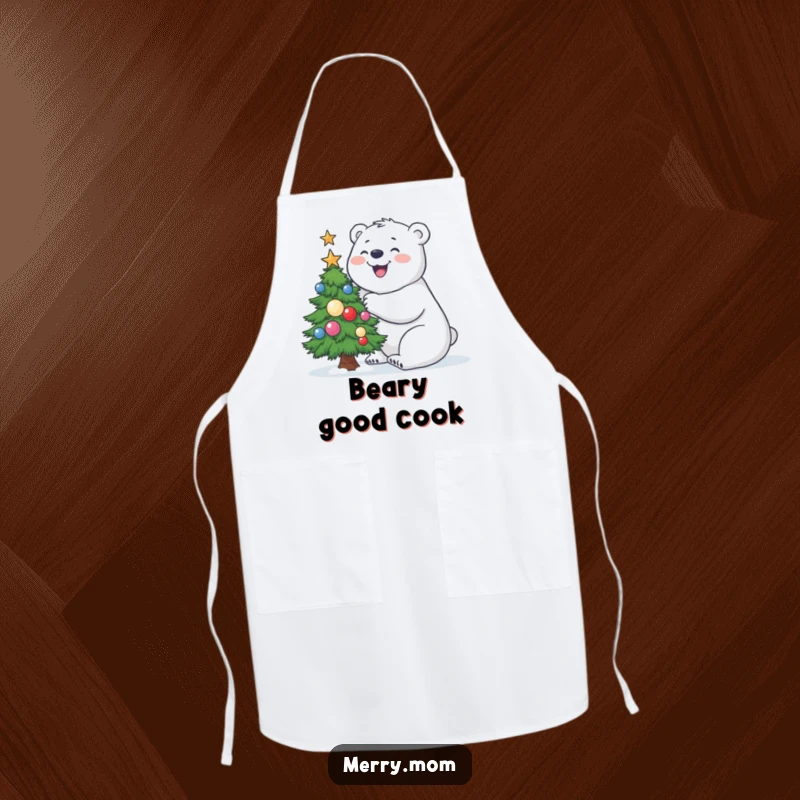 Funny Polar Bear Apron featuring a joyful polar bear building a small, decorated Christmas tree, ideal for holiday baking.