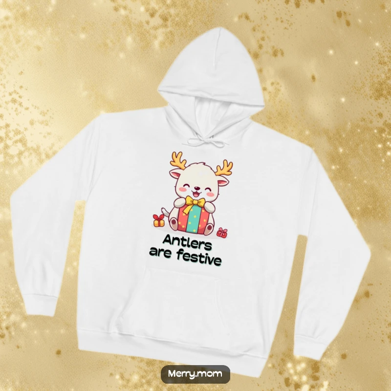Funny hoodie featuring a cute creature with festive antlers, happily unwrapping a colorful gift, embodying holiday delight.