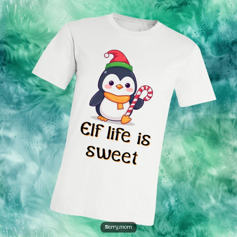 Funny Kawaii Penguin T-Shirt featuring a tiny elf hat and holding a candy cane, perfect for festive occasions.